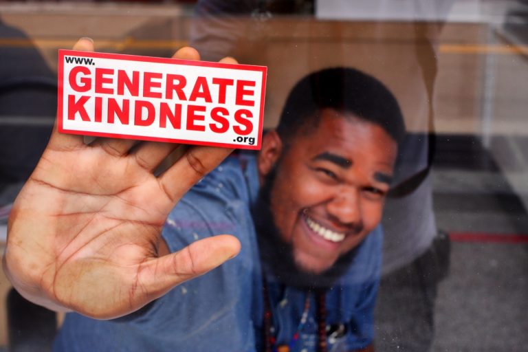 A Generate Kindness sticker in the wild